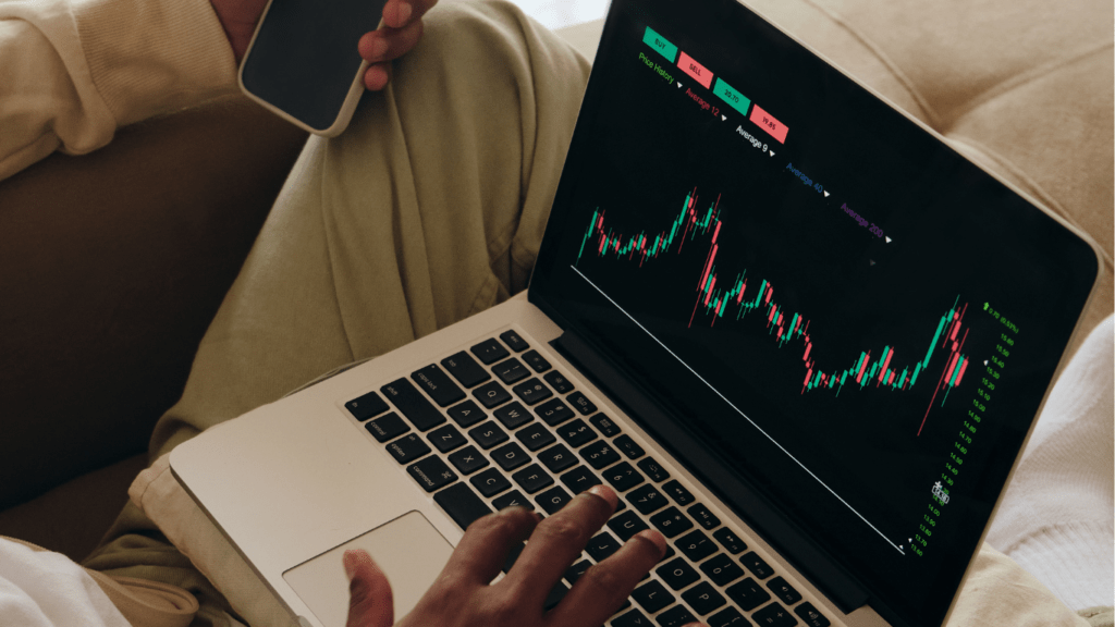 A Man Checking Stocks on his Laptop