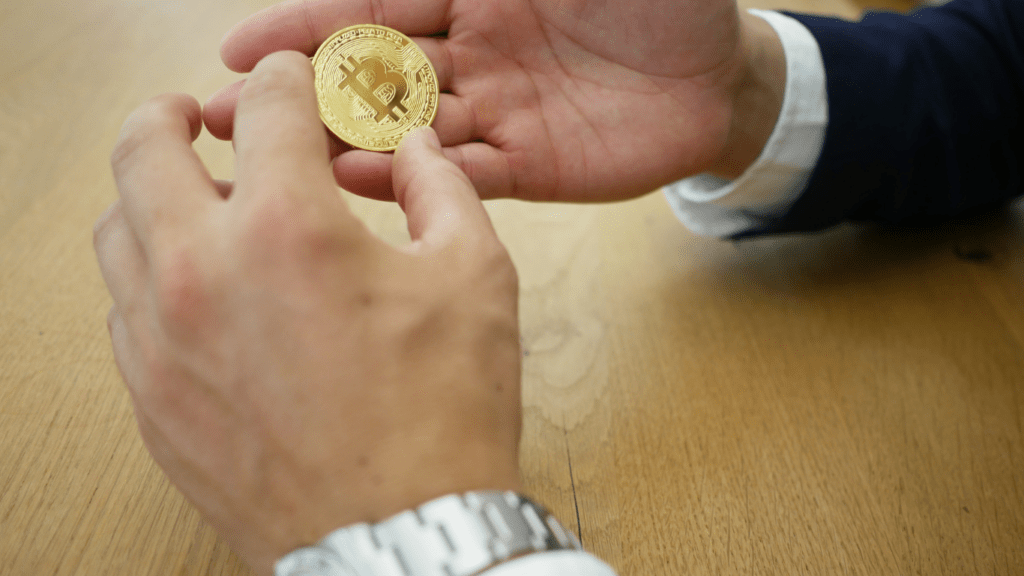 A Man holding a Bitcoin